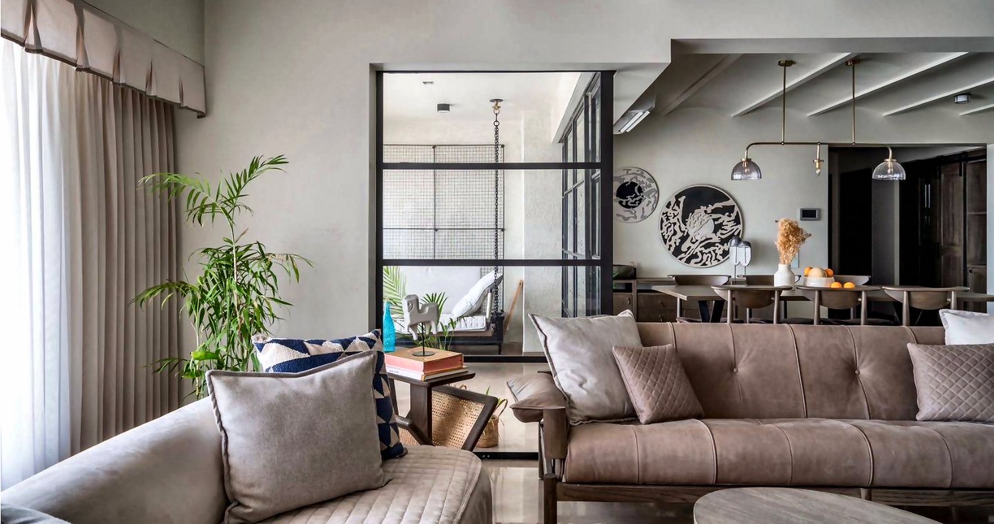 Sunlit Mumbai living room with floor-to-ceiling custom curtains supplied by Opulence Decor in Goregaon West