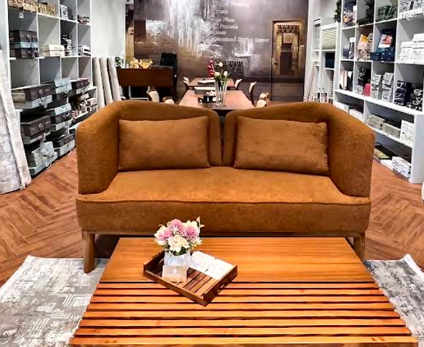 Caramel upholstered loveseat displayed at the Opulence Decor showroom in Goregaon West