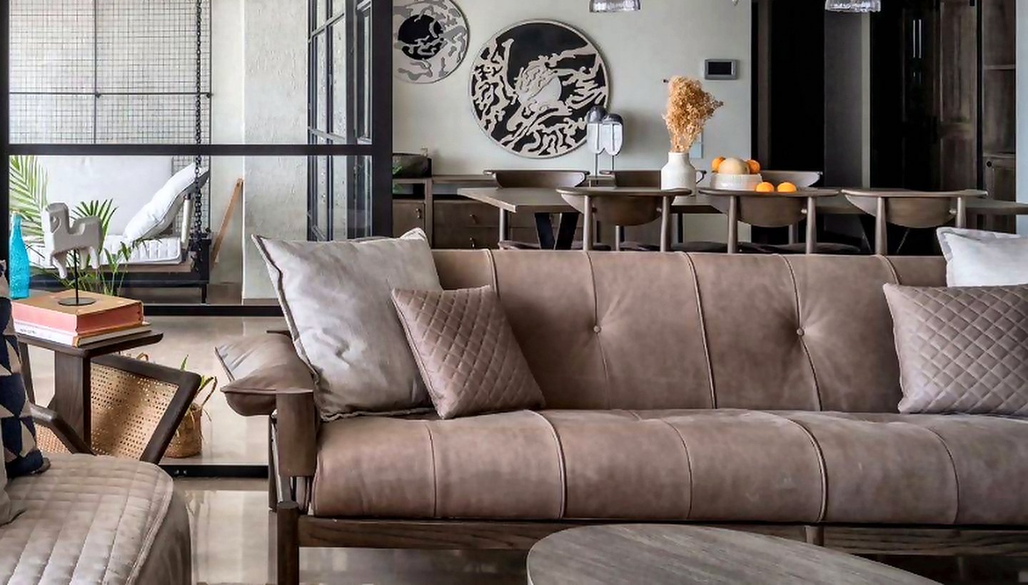 Sofa, cushions and curtains coordinated in one scheme